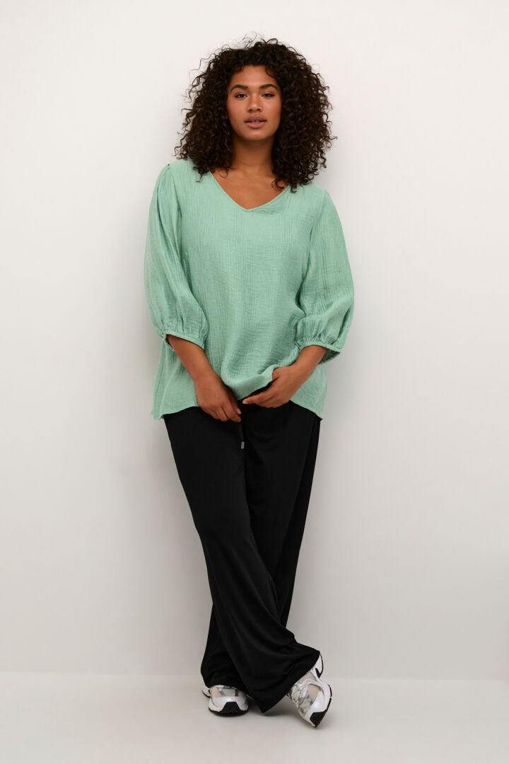 granite groene blouse met crinkle-effect en ballonmouwen