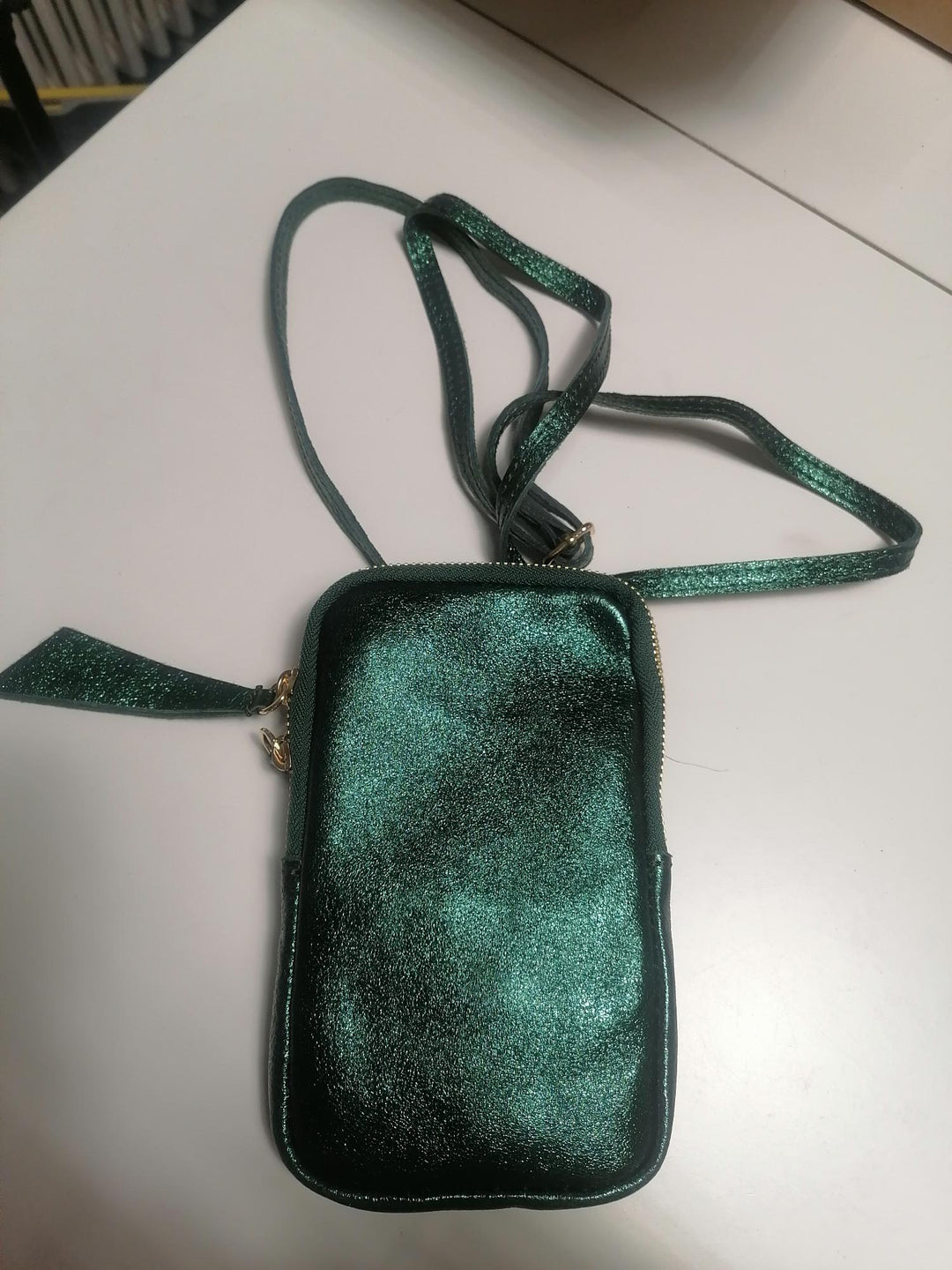 Mini dark green metallic crossbody bag made of leather 
