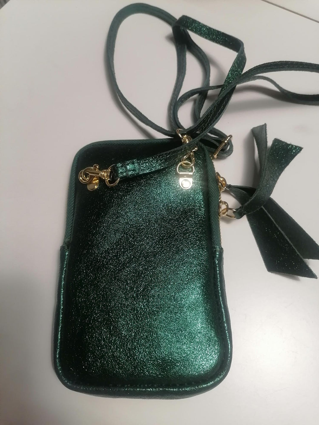 Mini dark green metallic crossbody bag made of leather 